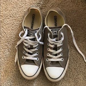 Greenish grey low top converse.